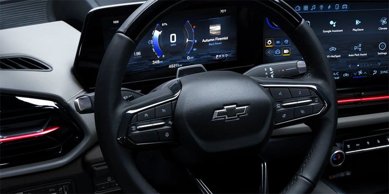 A view of a steering wheel inside of a Chevy Silverado in Herkimer, NY